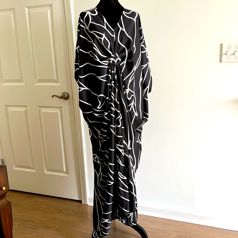 Silk black with cream stripes, free size kaftan with a ring on the chest.